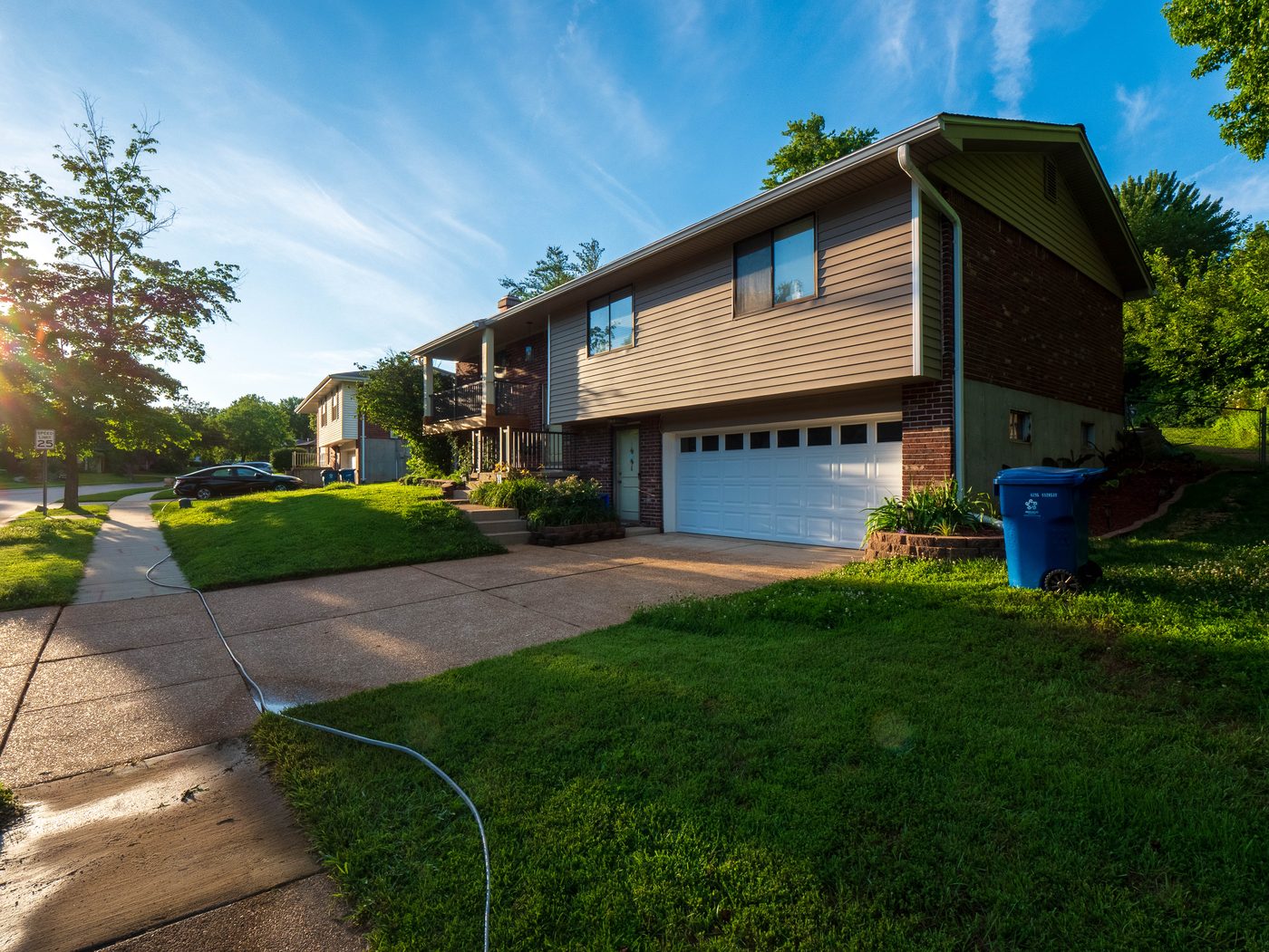 Rental property driveway after professional cleaning, South County St. Louis