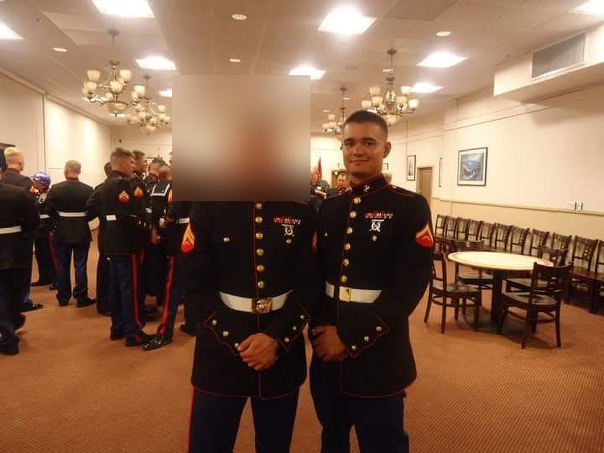 George Kindler, owner of Kindler Property Services, in his U.S. Marine Corps dress blue uniform at a military ceremony; a fellow Marine standing beside him is blurred for privacy