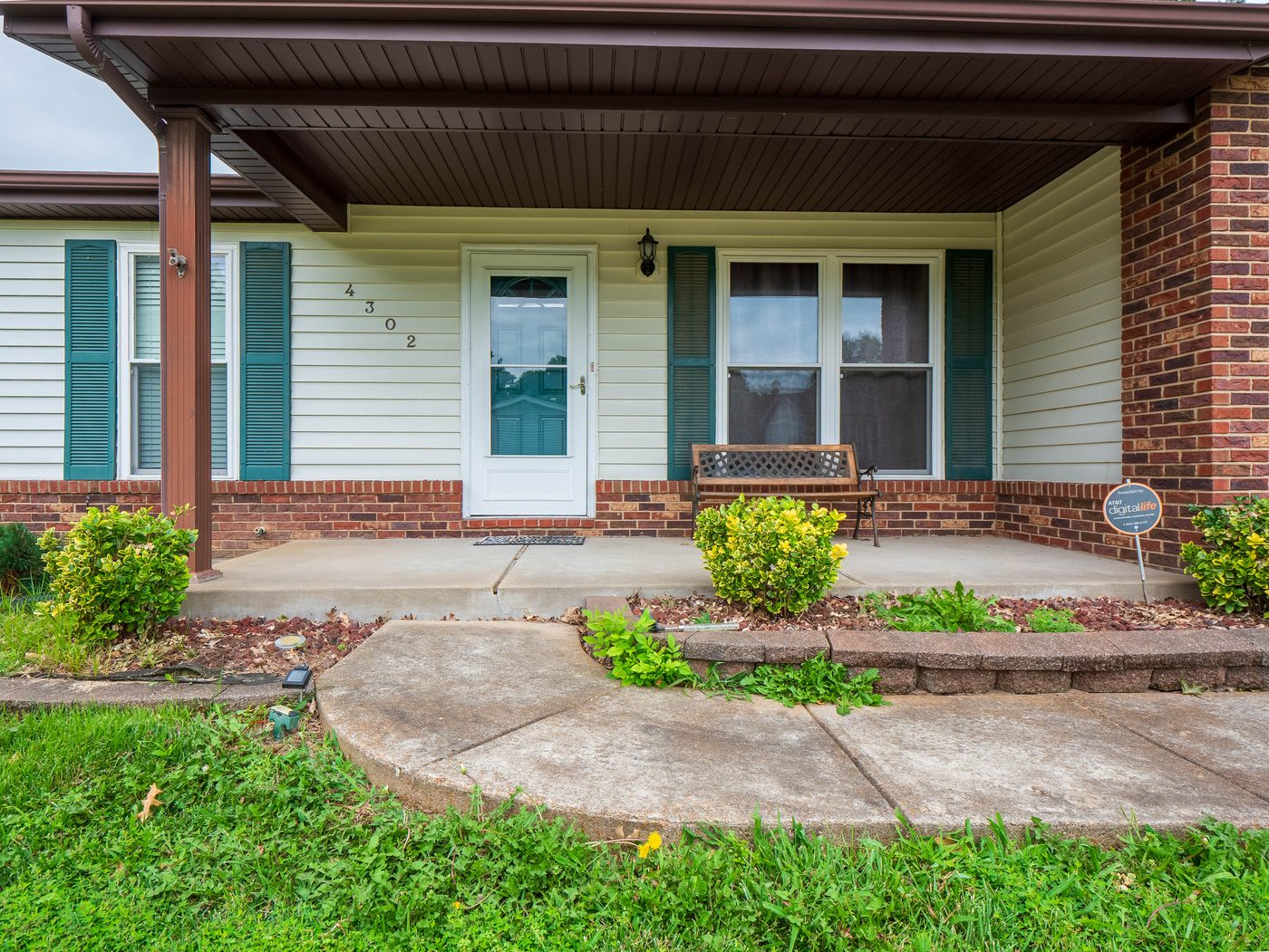 Concrete entryway and porch before professional cleaning, South County St. Louis